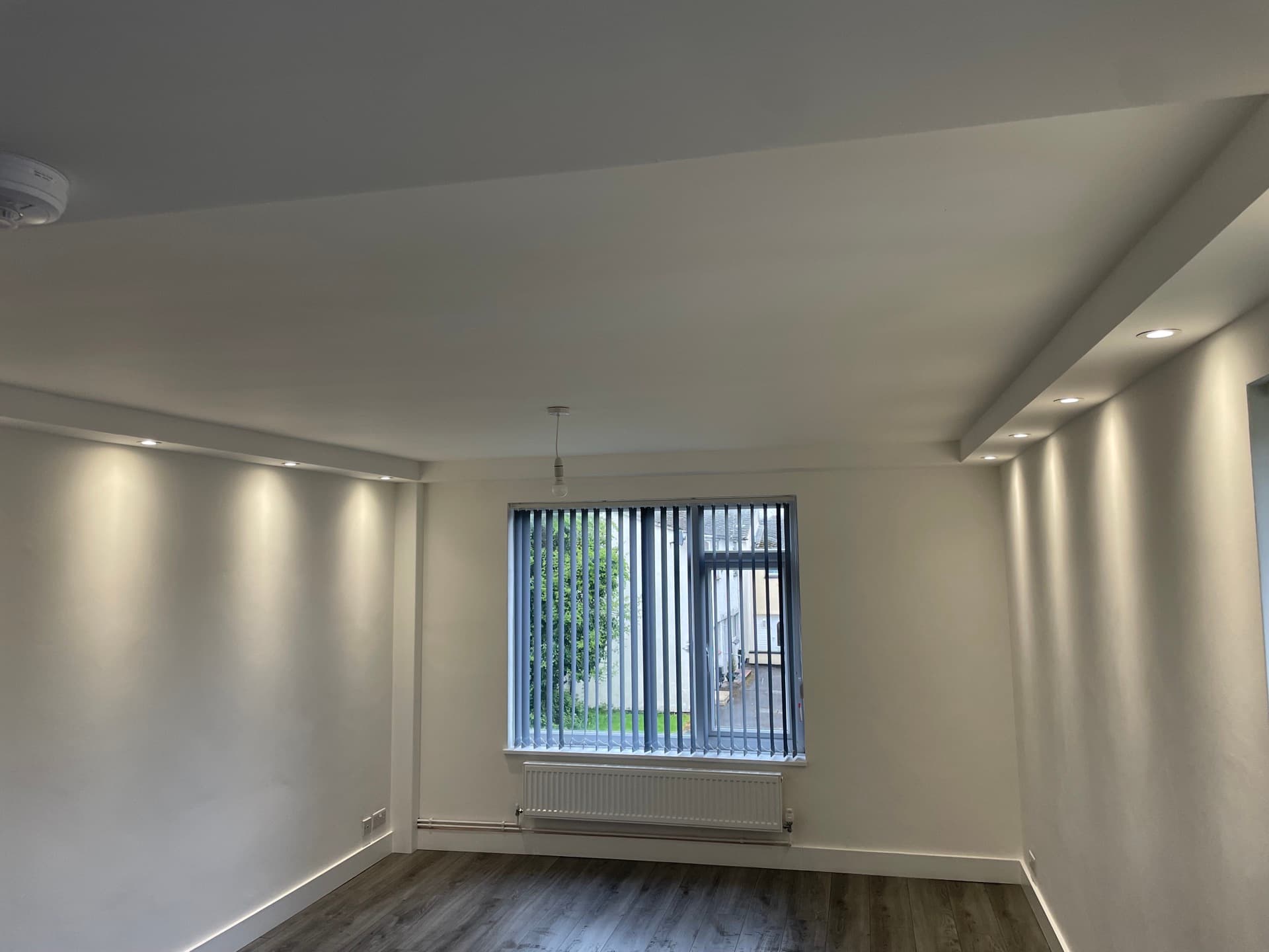 Modern interior lighting installation with LED and recessed fixtures