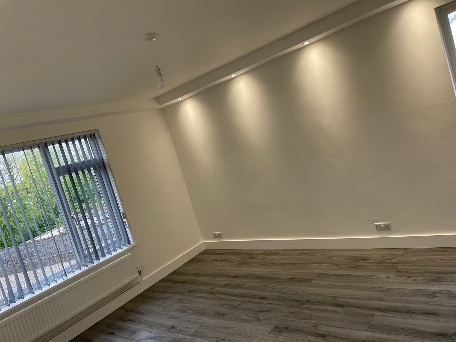 Modern interior room with professional electrical installation and LED lighting