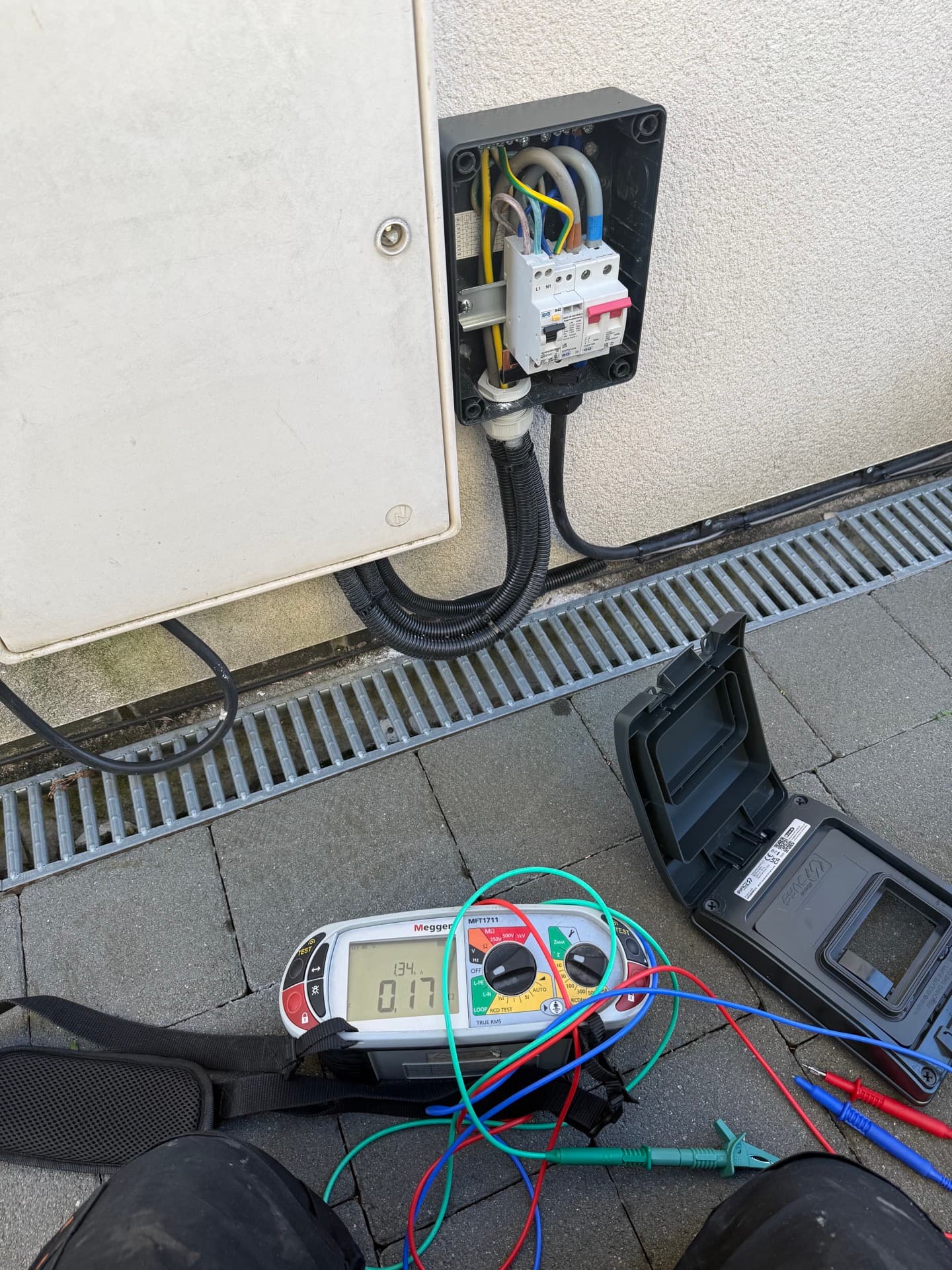 Electrical installation with conduit and testing equipment on site