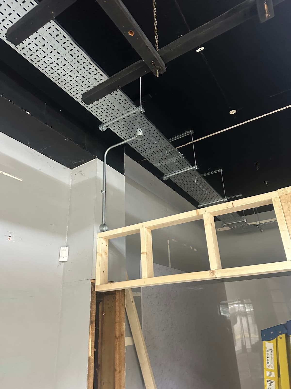 First-fix electrical containment and steelwork during the renovation